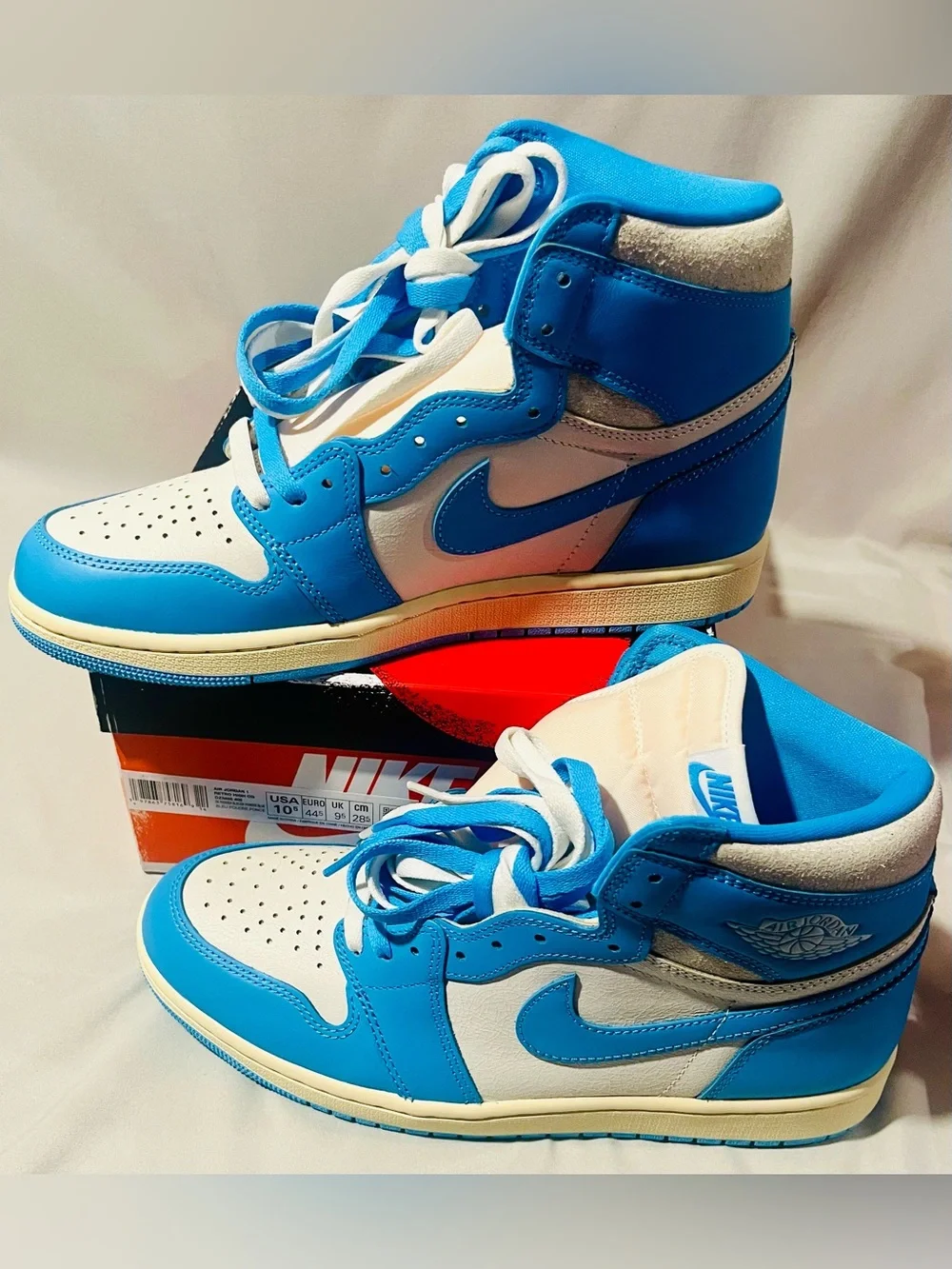 Nike Jordan Retro High-Top Sneakers in Baby Blue and White with Cream Midsole